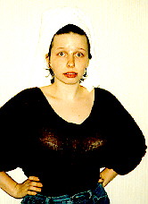 She's got a towel on her head and my very
stuffed bra on.